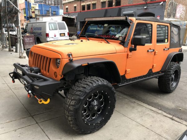 Orange Jeep Wrangler custom build by AutoCraft NYC
