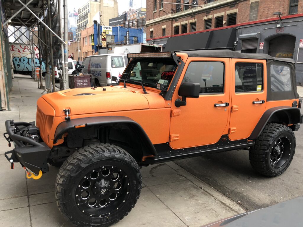 Orange Jeep Wrangler detail by AutoCraft NYC